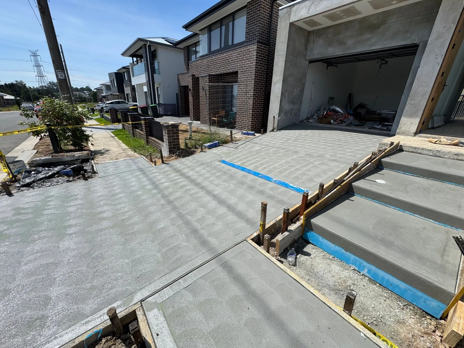 Driveway, steps and council footpath completed by Harbourline Group in Gregory Hills NSW